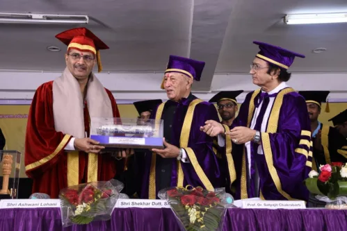 Shri Ashwani Lohani, Chairman & Managing Director, Air India, Former Chairman, Railway Board, Indian Railways being handed over the Honorary Ph.D degree